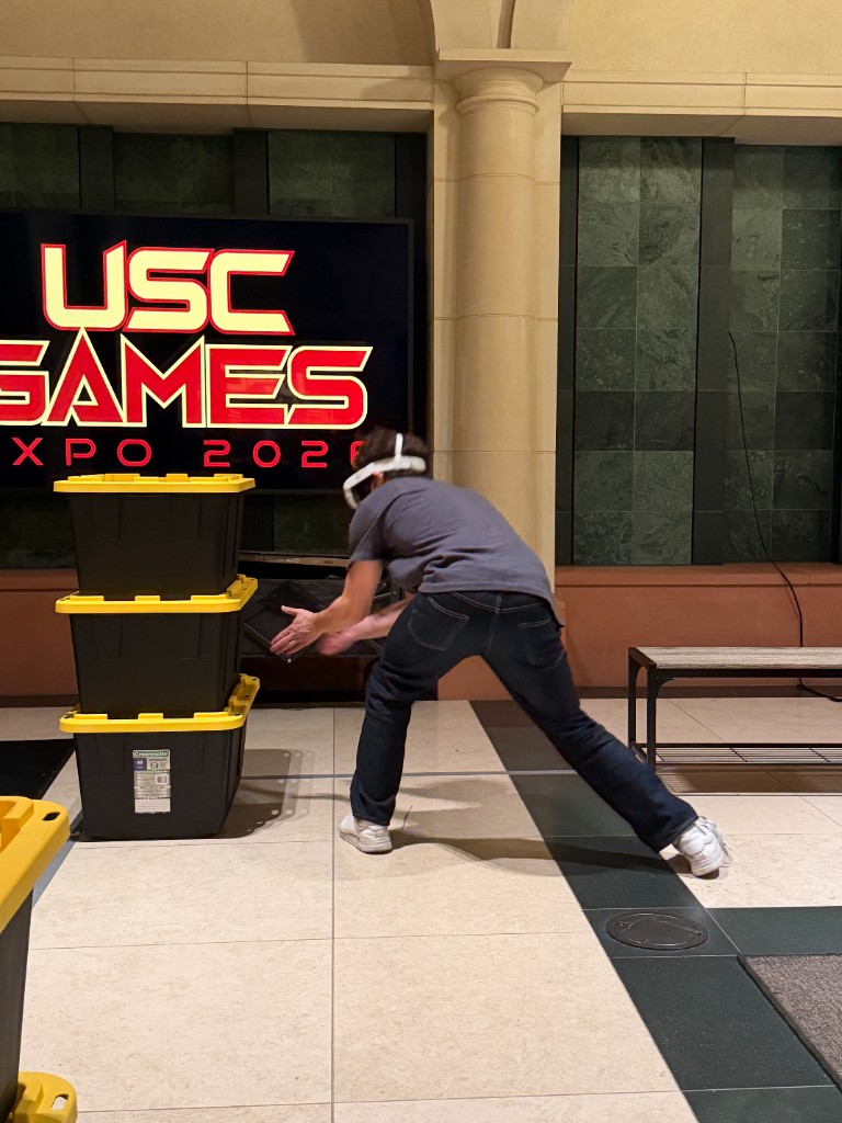 USC Games Expo 2026 booth moment with players testing Fly Exterminator.