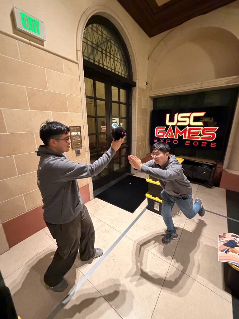 Matthew Tran and Chaeho Shin recreating the Fly Exterminator cover-art pose.